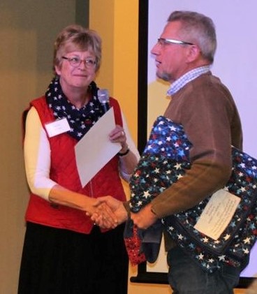 Presenting a Quilt of Valor to Vietnam Veteran Robert Erickson Jr.