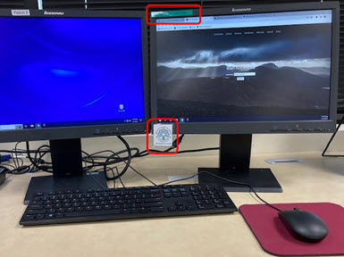 photo of two computer monitors with the IGSI logo attached